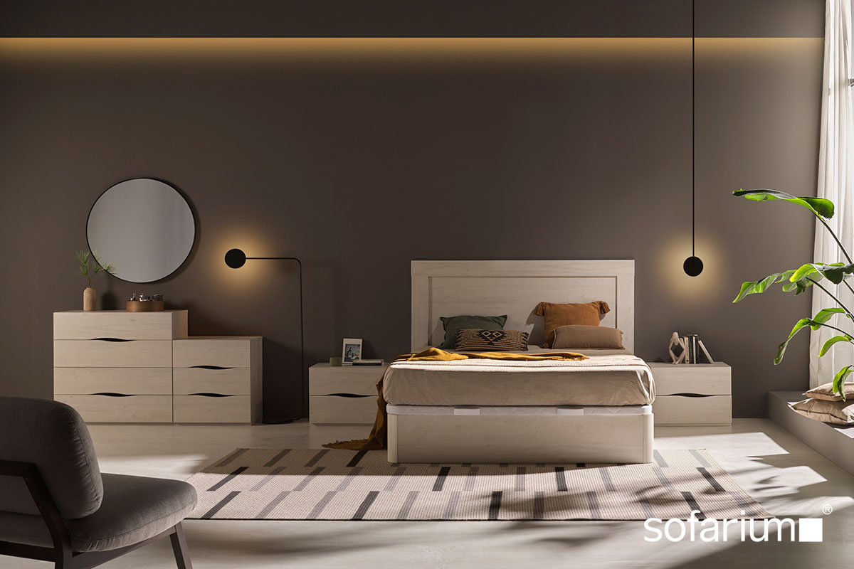 Dormitorio Sofarium con cama, cabecero y artículos de descanso